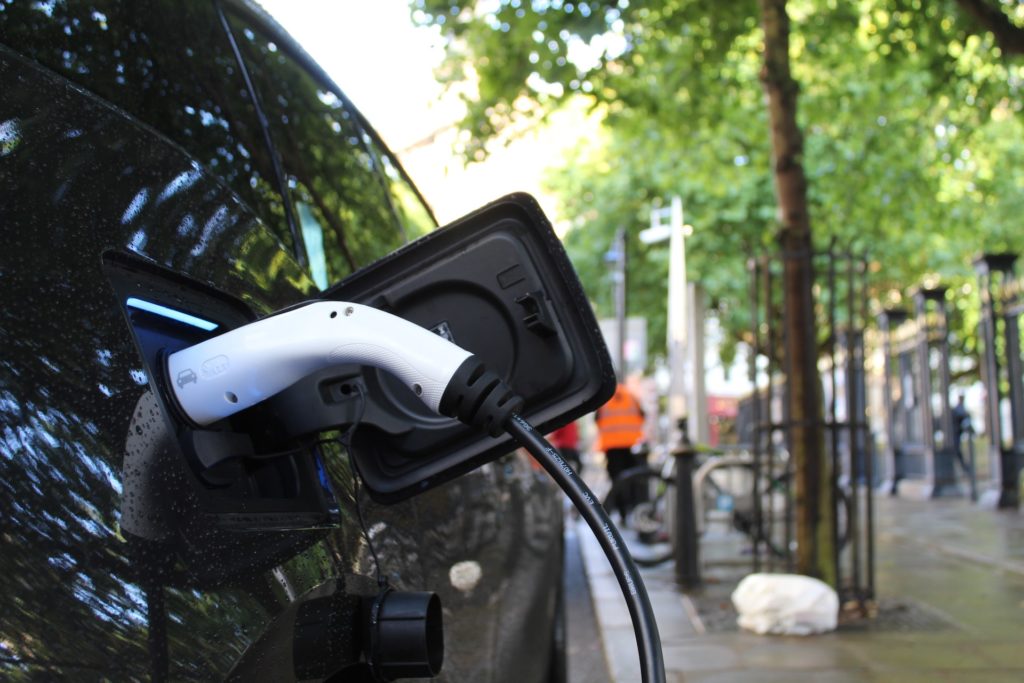 electric vehicle being charged on a street in seattle