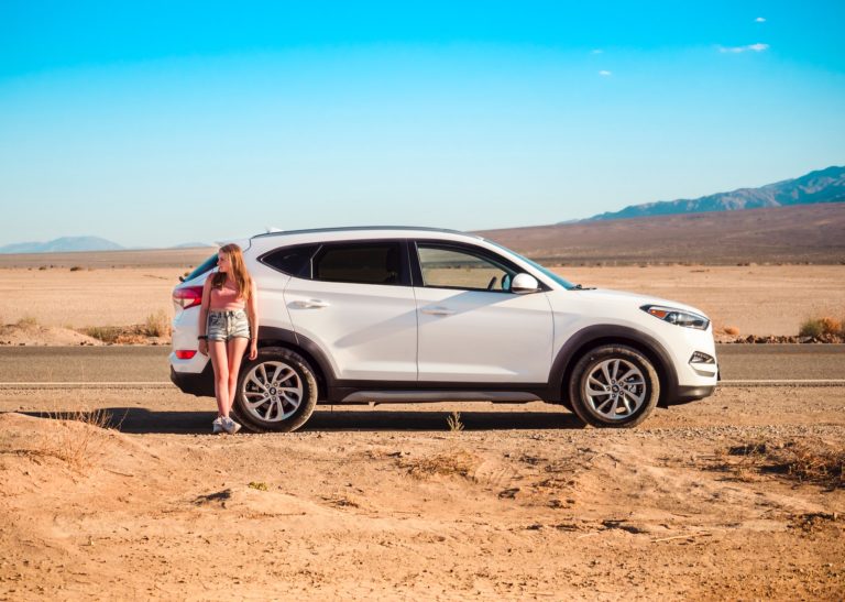 woman traveling in a rental car